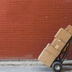 shipping-boxes-in-front-of-red-brick_4460x4460